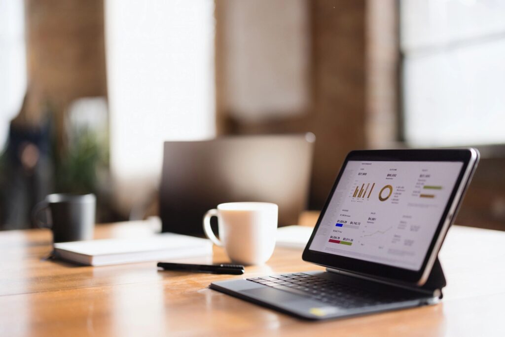 Close-up of financial charts and performance graphs on a tablet at an office desk